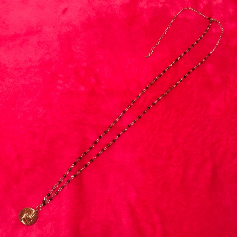 Beautiful brown beads with gold pendant